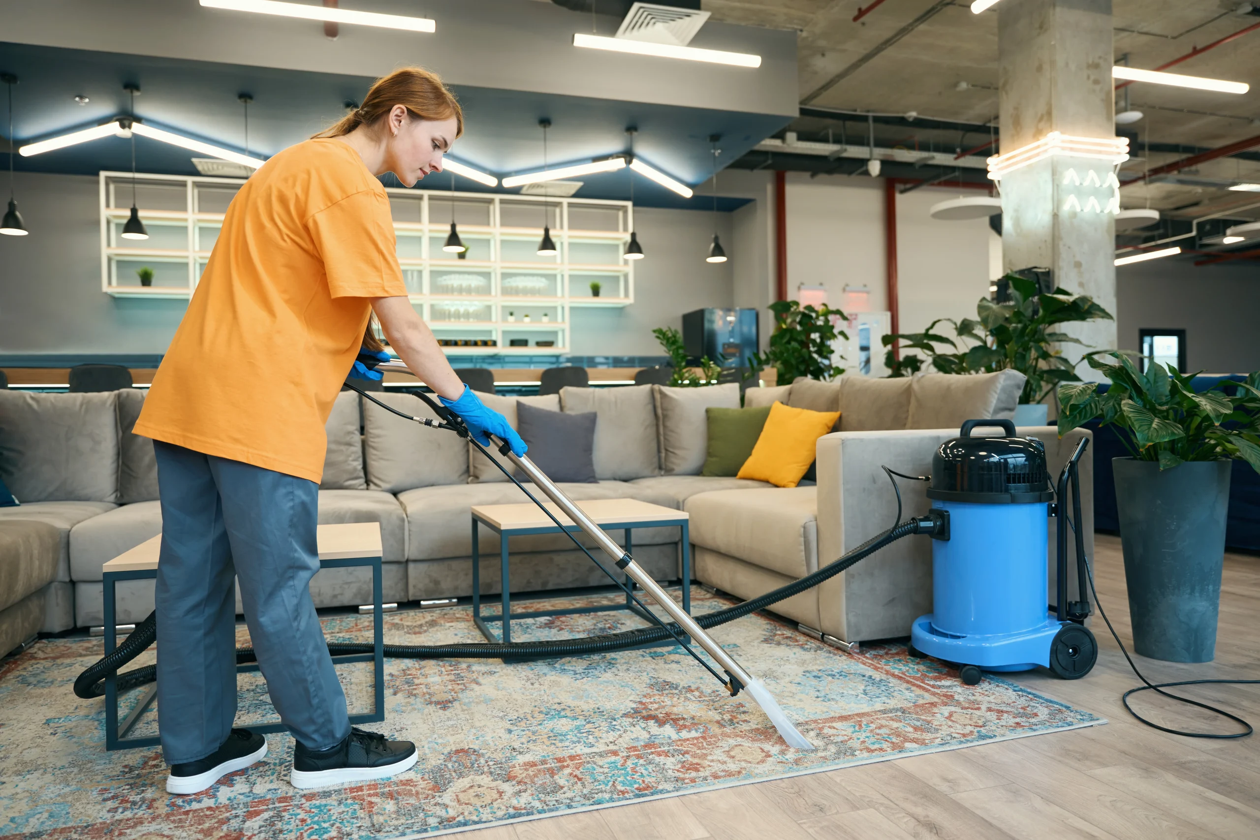 cleaning-company-worker-cleans-a-carpet-in-a-recre-2025-03-08-04-34-52-utc